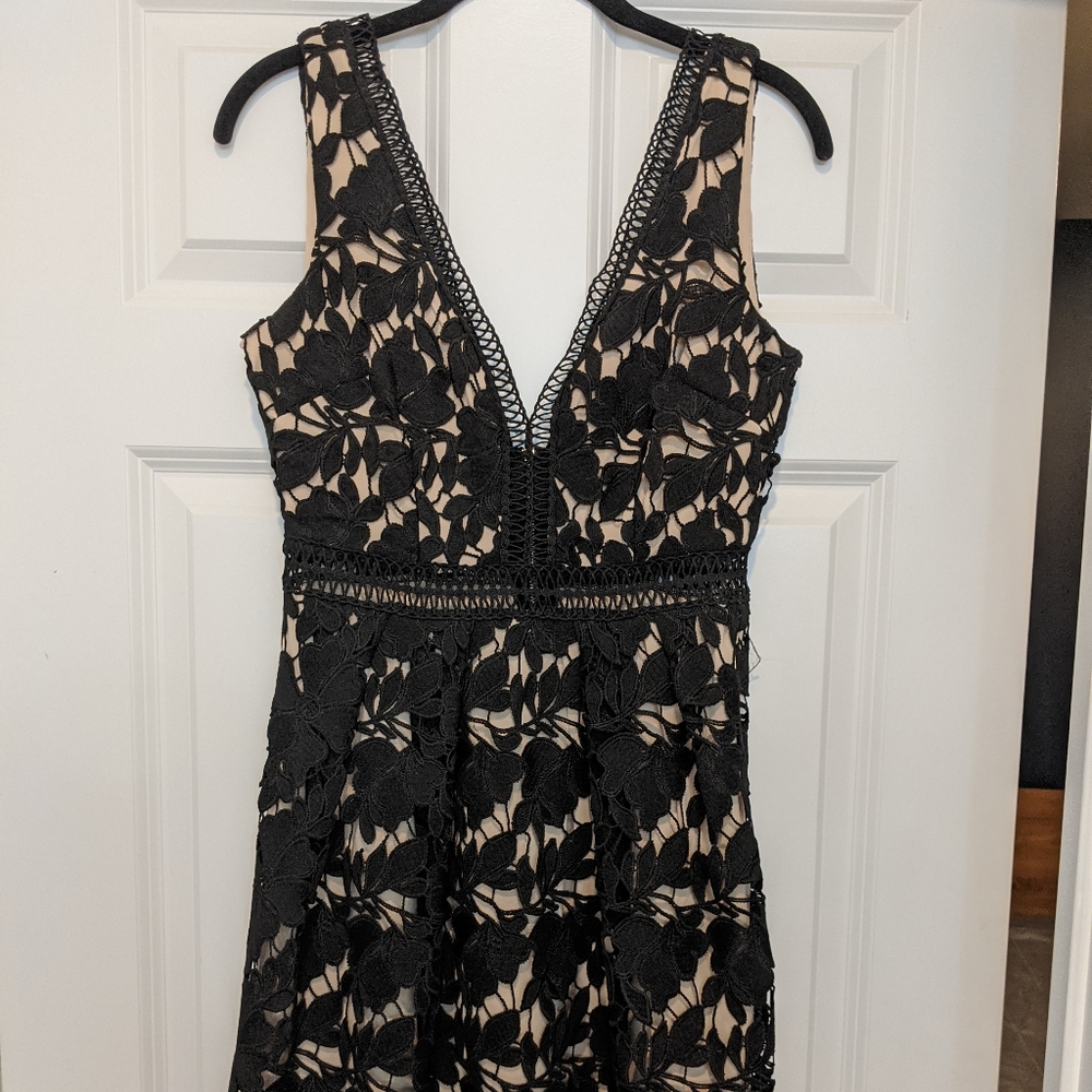 Plunging black lace dress
